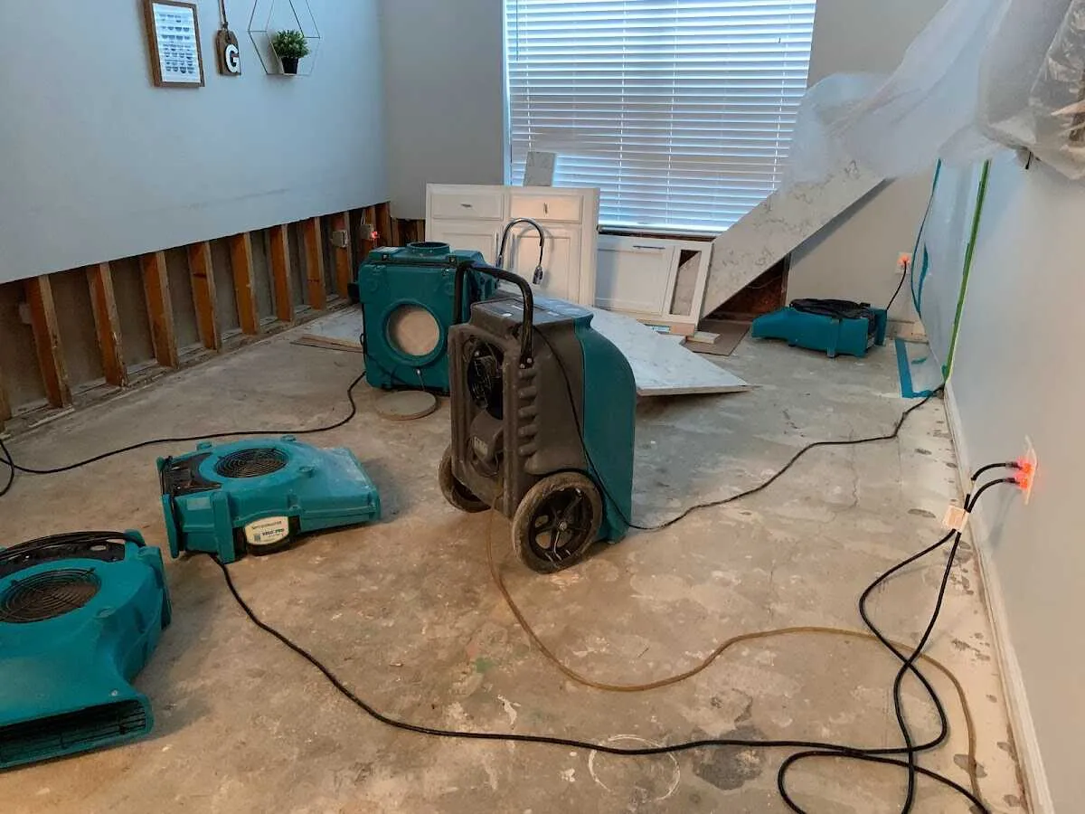 Dehumidifier in flood-cut room for Water Damage Restoration in St. James
